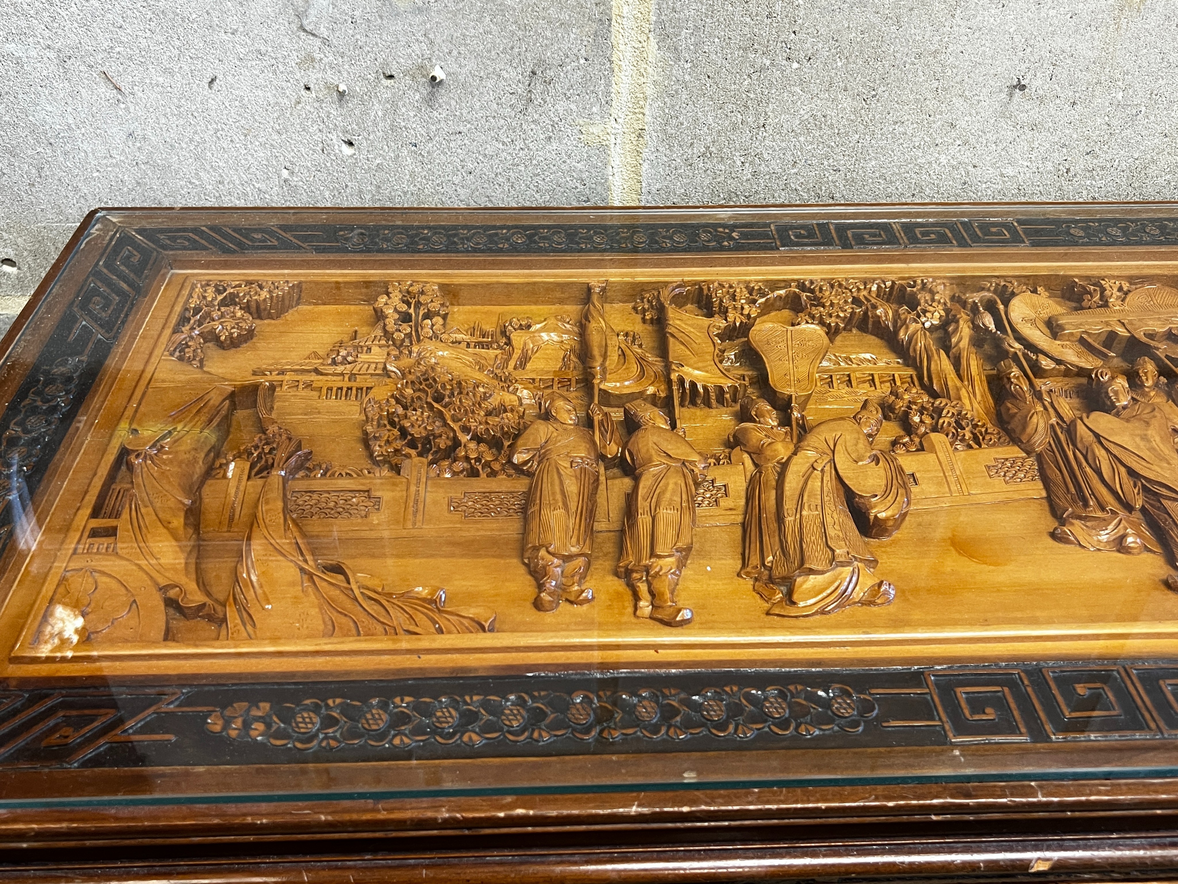 A Chinese carved hardwood low table, length 110cm, depth 43cm, height 36cm